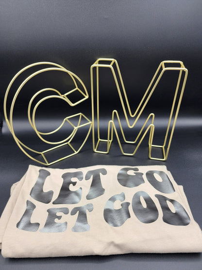 Let go let God, tan color t-shirt.